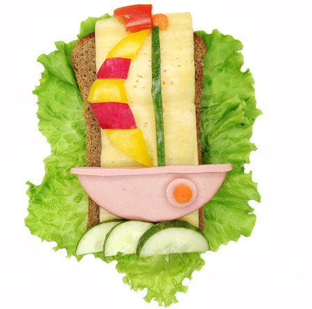 creative sandwich with cheese and salami ship formの写真素材