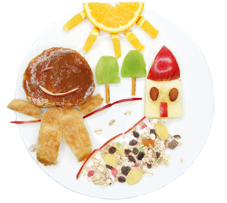 creative breakfast food with fruit and chocolate sweet cream on breadの写真素材