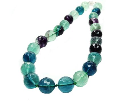 fluorite gemstone beads isolated on white backgroundの写真素材