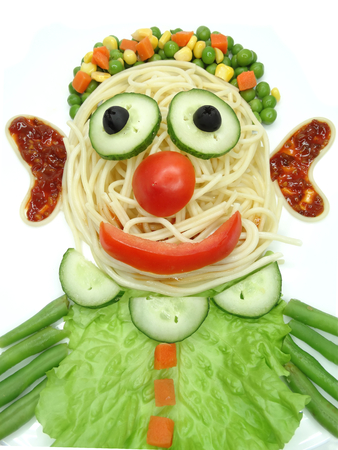 creative vegetable food meal with spaghetti clown formの写真素材