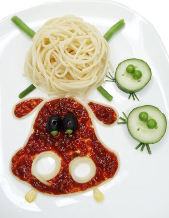 creative vegetable food meal with spaghetti and sausage begemoth formの写真素材