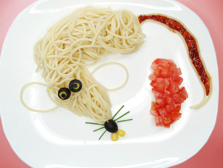 creative vegetable food meal with spaghetti mouse formの写真素材