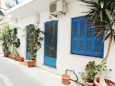 door architecture detail in house building with bougainvillaea Greeceの写真素材