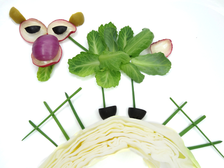 creative funny vegetable food snack with cucumber cow formの写真素材
