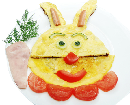 creative breakfast meal with scrambled egg face formの写真素材