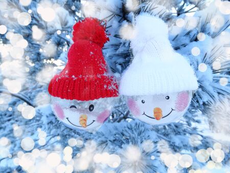 christmas background shiny snowman decor on fir branches frameの写真素材