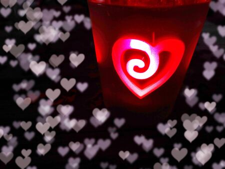 hearts candles love concept valentine's day on wooden backgroundの写真素材