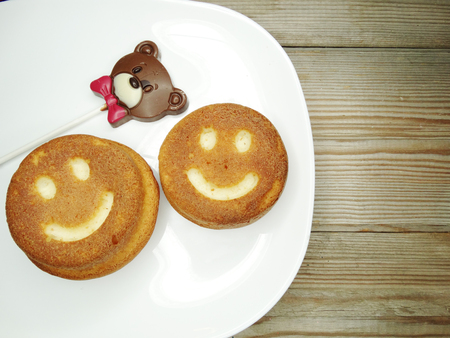 creative baked food cakes funny faces and chocolate bear for valentine's dayの写真素材