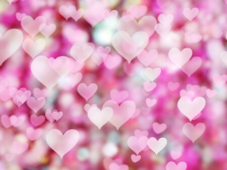 abstract background love colorful red blurs with shiny heartsの写真素材