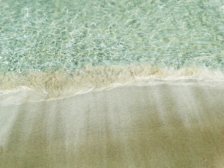 blue crystal water and white sand summer beach and holiday background with copy spaceの写真素材