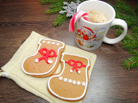 christmas cookies and gingerbread traditional food on wooden board fir branches