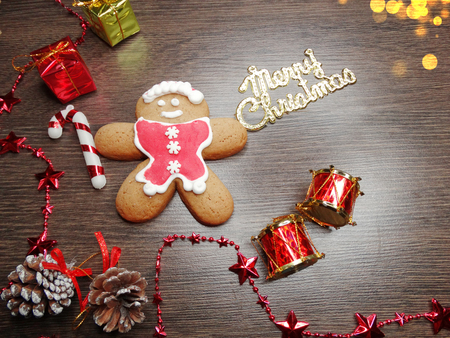 christmas cookies and gingerbread traditional food on wooden board fir branches