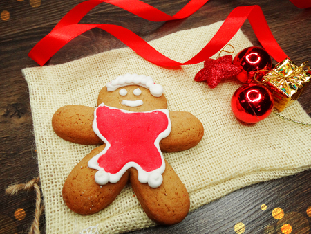 christmas cookies and gingerbread traditional food on wooden board fir branches