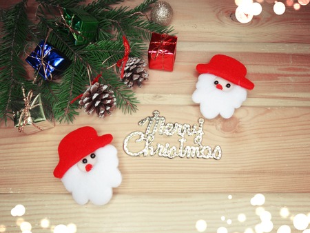 christmas background with garland on wooden board
