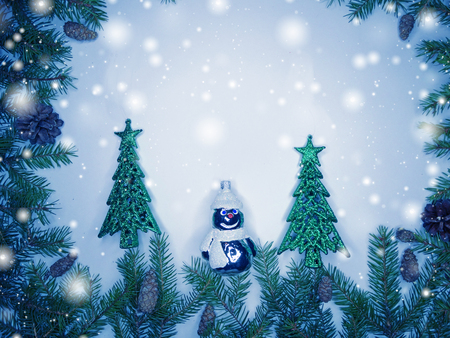 christmas background with fir branches frame snow and decoration snowmanの写真素材