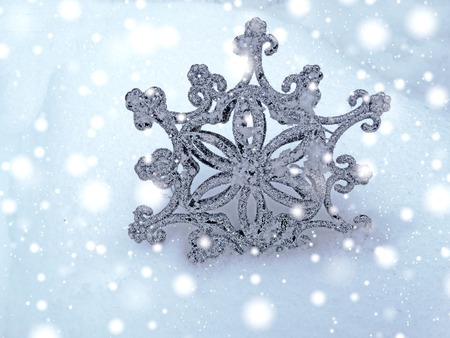 snowflake decoration in snow merry christmas backgroundの写真素材