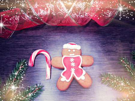 christmas cookies and gingerbread traditional food on wooden board fir branches 