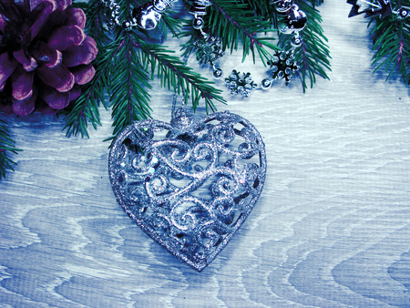 christmas decoration with garland lights on fir branches backgroundの写真素材