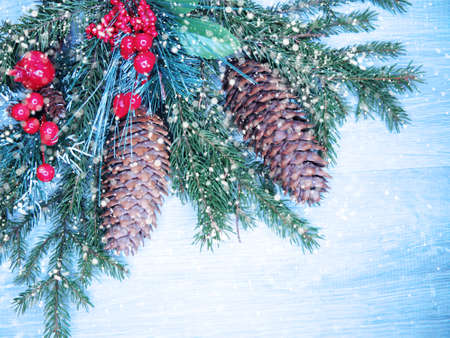 christmas background and decoration with fir branches snow on wooden boardの写真素材