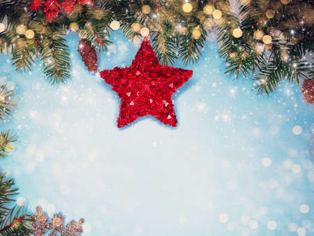 christmas decoration with garland lights on fir branches backgroundの写真素材