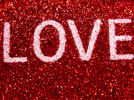 abstract background love colorful red blurs with shiny heartsの写真素材