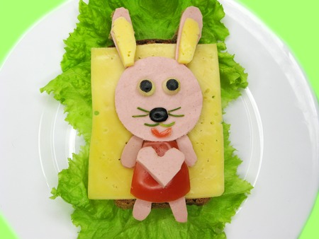 creative sandwich snack with sausage and cheese for child hare formの写真素材