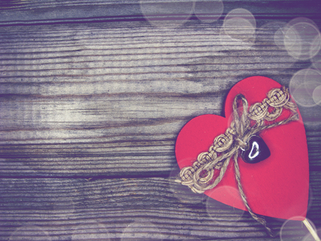 greeting card love valentine's day with hearts on vintage wooden background and copy spaceの写真素材