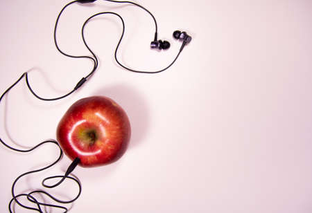 Apple and headphones. Clubhouse app conceptの写真素材
