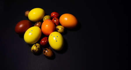 Easter eggs on black background. Copy spaceの写真素材