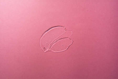 Cosmetic gel product on pink background. Texture and backgroundの写真素材