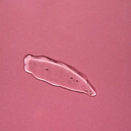 Cosmetic gel product on pink background. Texture and background