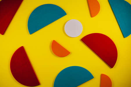 Colorful abstract geometric background with wooden shapes. Stand out from the crowd, think differently. Uniqueness conceptの写真素材