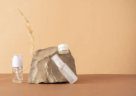 A set of cosmetics products with natural materials. Stones and spikelet. Natural organic cosmetic. Beauty concept. Wabi sabi trendの写真素材