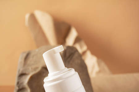 Cosmetics bottle with cosmetic product, natural materialsの写真素材