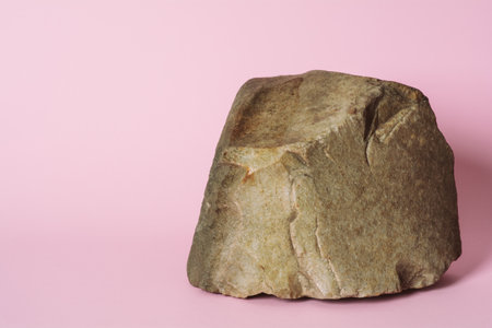 Creative stone podium for cosmetics or products on pink background.の写真素材