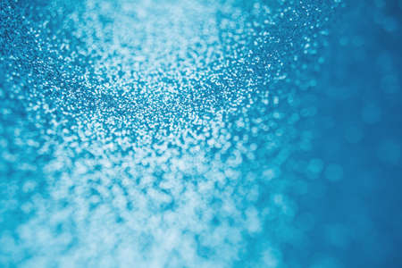 Abstract shiny blurred blue background. Textured glittering backdropの写真素材