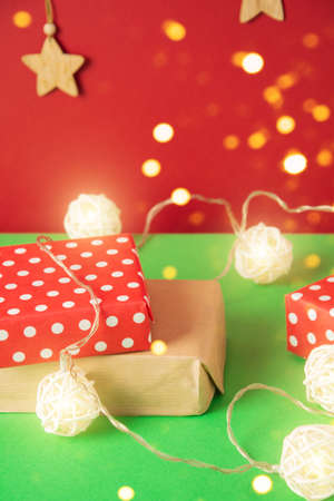 Gifts, christmas toys and garland on a green backgroundの写真素材