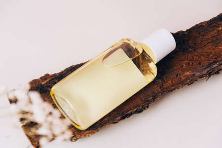 Bottle with cosmetic oil or essential aroma oil. Aromatherapy and massage. Health and medicine concept, beauty and selfcareの写真素材