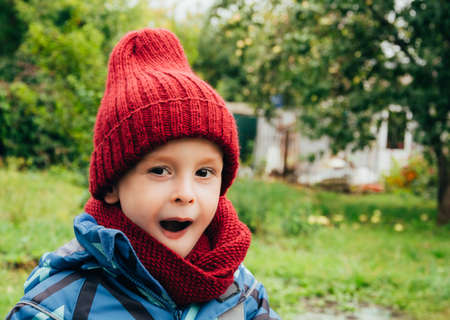 Child expresses emotions outdoors, amaze, surprise and wow. Copy spaceの写真素材