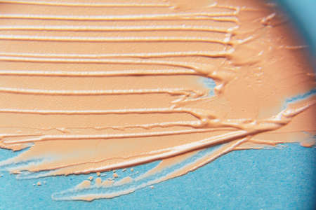 The texture of the foundation is beige under the make-up. Beautiful textured background for your...