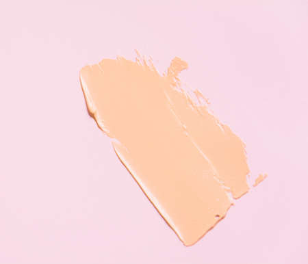 The texture of the foundation is beige under the make-up. Beautiful textured background for your...