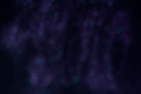 Purple festive abstract background with green and blue bokeh. Copy spaceの写真素材