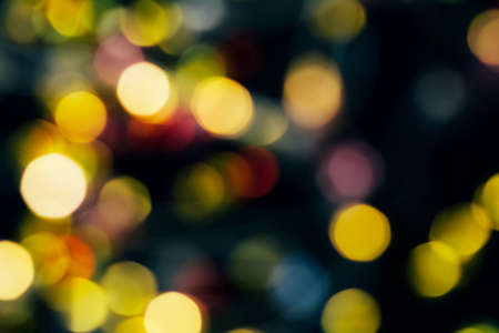 Festive abstract background, sparkling yellow and red bokeh. Copy spaceの写真素材