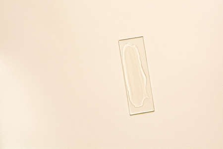 Sample of transparent cosmetic product on glassの写真素材
