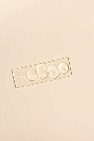 Sample of transparent cosmetic product on glassの写真素材