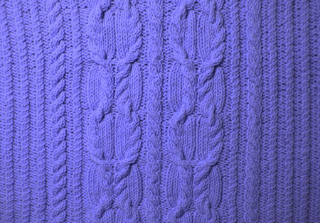 Background knitted of purple threads. Backdrop of your design. Color of the Year 2022