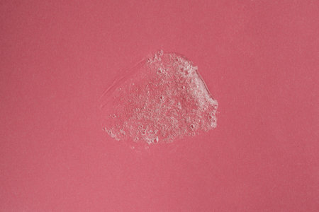 Liquid gel cosmetic product with bubbles on pink background. Texture and backgroundの写真素材