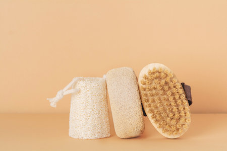 Eco friendly bathroom accessories on beige background. Beauty, sustainable and wellness conceptの写真素材
