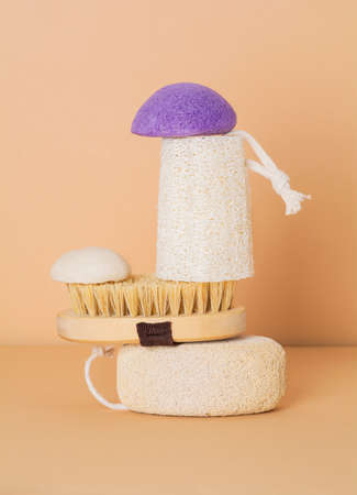 Eco friendly bathroom accessories on beige background. Beauty, sustainable and wellness conceptの写真素材