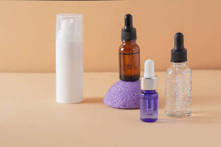 Beauty, spa and wellness concept. Facial cosmetic products, konjac sponge on a beige background. Health and medicine concept, beauty and selfcare. front viewの写真素材